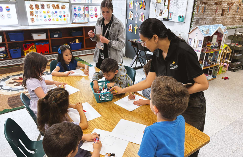 St. Clair College Early Childhood Education students interact and instruct kindergarten students at Notre Dame Catholic Elementary School