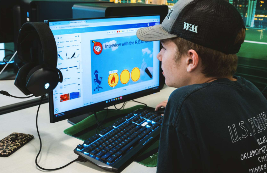 A Camper engages in a gaming activity at the 2025 March Break summer camp at the St. Clair College Esports Nexus Arena