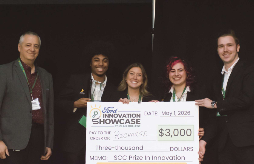 St. Clair VP Ralph Nicoletti stands with team ReCharge - John Beverly, Rain Marek, Sarah Raymond and Ayden Reaume, for their SCC Prize in Innovation at the Ford Innovation Showcase