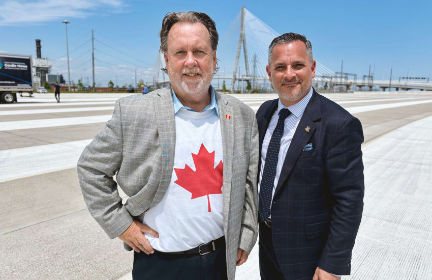 John Fairley and Michael Silvaggi posing with bridge in background