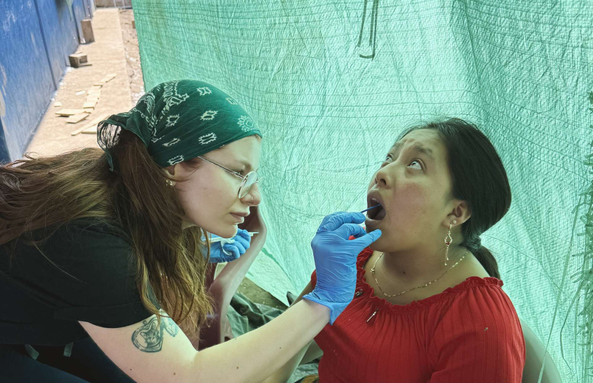 St. Clair College Dental Hygiene student Caroline Bemben doing a dental exam