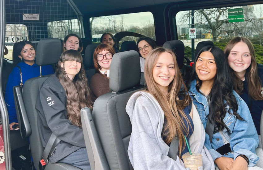 Students from the Early Childhood Education program at St. Clair College pose for a photo in a van ahead of their trip to Urbania, Italy