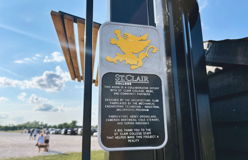A St. Clair College commemorative plaque on the Libro Centre Bike Trails Kiosk