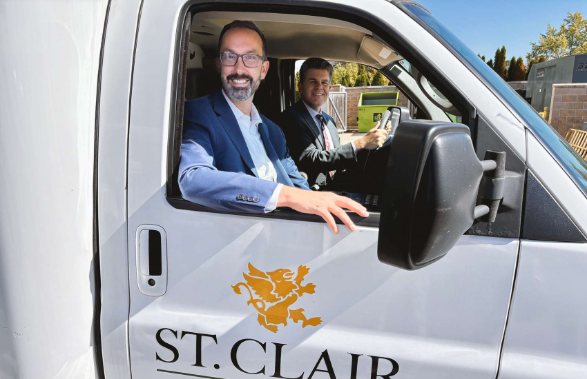 MCURES Minister Nolan Quinn and Windsor-Tecumseh MPP Andrew Dowie pose in the St. Clair College ambulance during a tour of campus