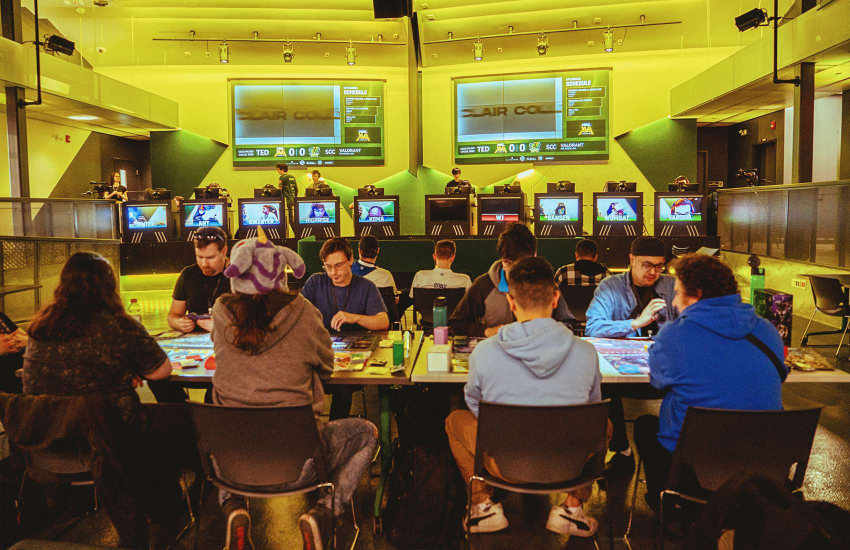 Participants play board games at the Esports Nexus Arena