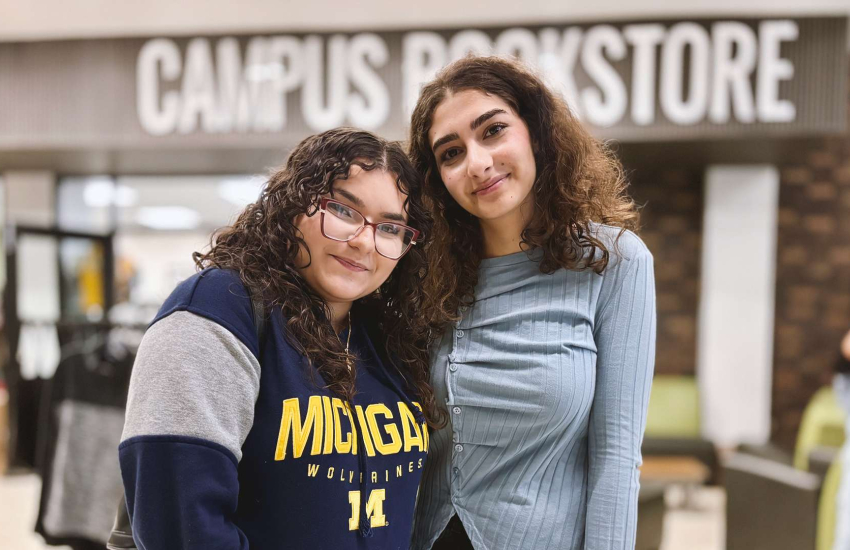First-year students Dali Yaquv and Ayah Navha get acquainted while they wait in line for scrubs