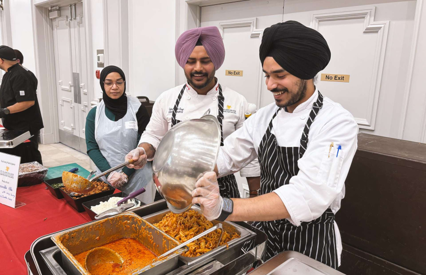 Members of the St. Clair College Centre for the Arts Culinary team dish out Campanelle Alla Vodka at the Pastabilities Luncheon