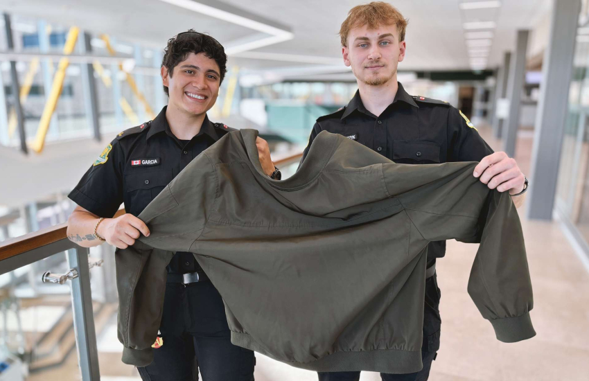 Students holding jacket