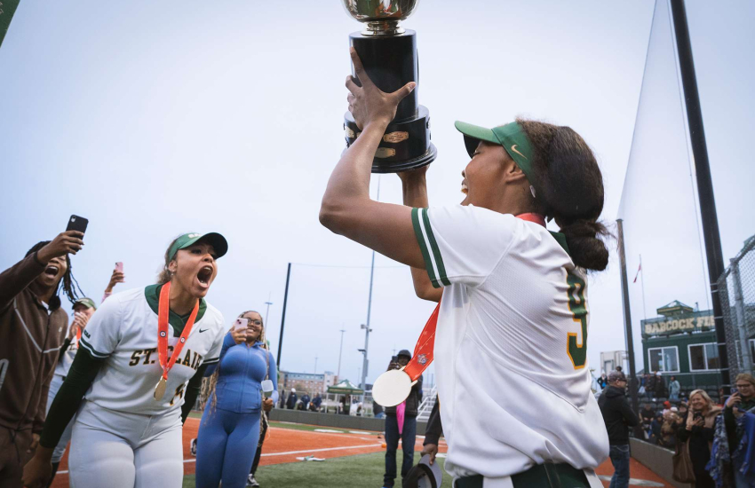 Members of the Saints Women's Softball team celebrates a CCSA National Championship