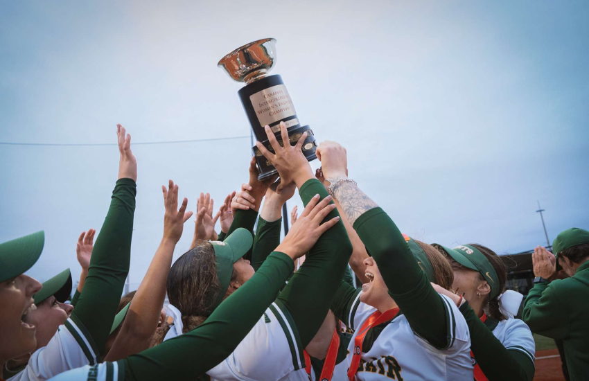 Members of the Saints Women's Softball team celebrates a CCSA National Championship