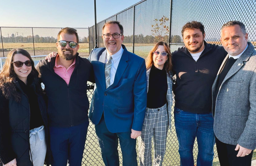 Members of student government are joined by outgoing Chatham-Kent Mayor Darrin Caniff and St. Clair College President Michael Silvaggi at the St. Clair College Community Park in Chatham