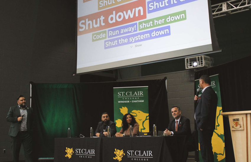 Representatives from siberX, SANS, and St. Clair College running a simulation during a partnership announcement at Main Windsor Campus