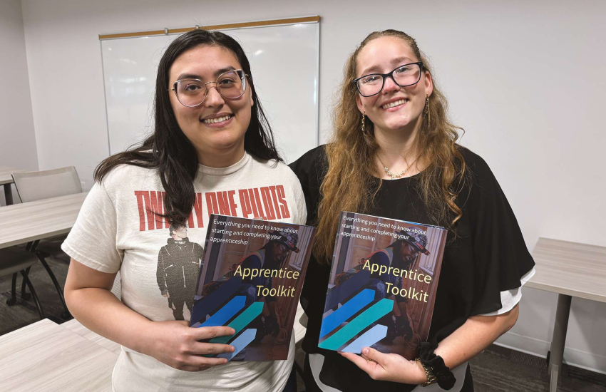 Two students displaying toolkits