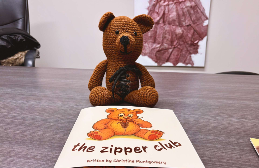Buttons the Bear and a copy of The Zipper Club.