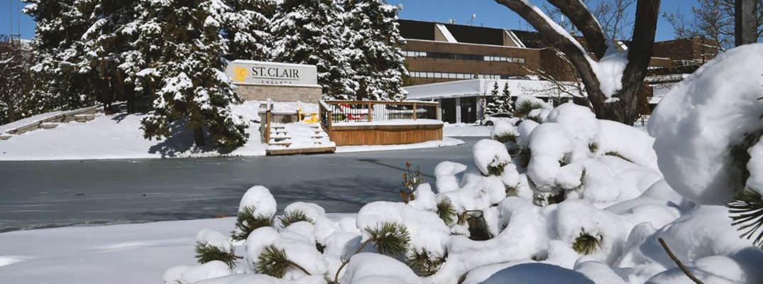 College pond and area covered in ice and snow