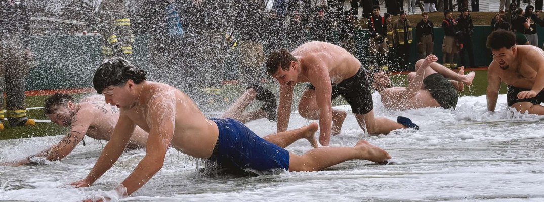 St. Clair College students taking part in the Polar Plunge Slip n' Slide