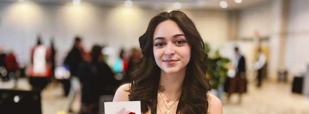 SamiaRose Ferrarelli, a third-year Graphic Design student at St. Clair College showcases her mural work during the annual Grad Show