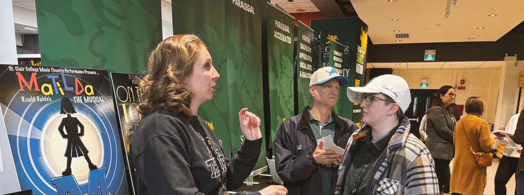 Music Theatre Performance Prof. Kristyn Wiklanski speaks with a prospective student at the St. Clair College Spring Open House at Main Windsor Campus