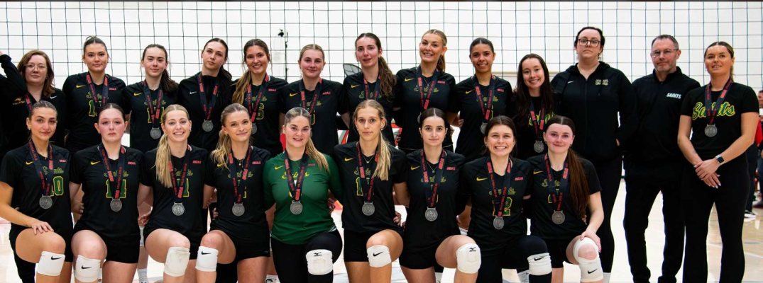 Saints Women's Volleyball team sporting OCAA silver medals