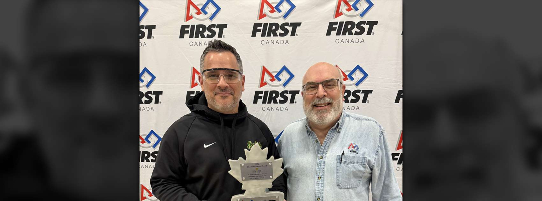 St. Clair College President Michael Silvaggi holding the FIRST Robotics Canada Education Partner Excellence Award with Larry Koscielski of Windsor-Essex FIRST Robotics 