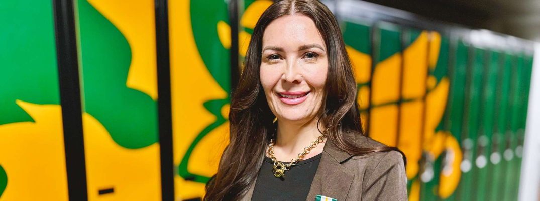 St. Clair College Prof. Stacey Robert-Tobin stands with her Queen Elizabeth II Medal for Good Citizenship