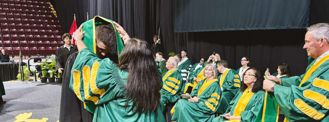 A student crossing the stage