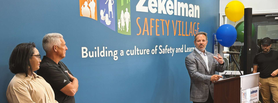 Barry Zekelman of the Stephanie and Barry Zekelman Foundation speaks to a crowd at the newly renamed Zekelman Safety Village during a launch party