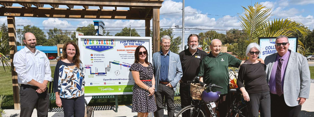 Sponsors and City of Windsor representatives gather to kick off Open Streets 2026 at the Farrow Riverside Miracle Park