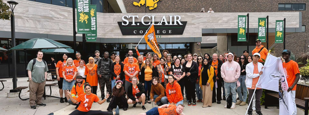 Students, faculty and staff pose at St. Clair College's Windsor Main Campus
