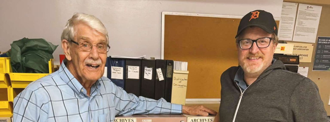 Bill Totten and filmmaker Mike Evans meet at St. Clair College's archive room