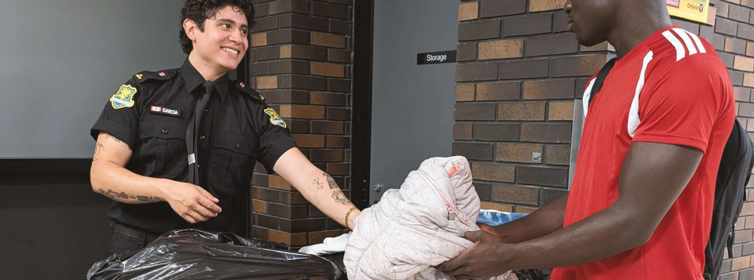 Man handing over clothing
