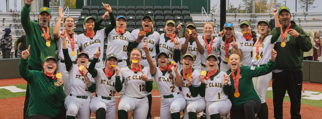 The St. Clair Saints Women's Softball team celebrates a gold medal