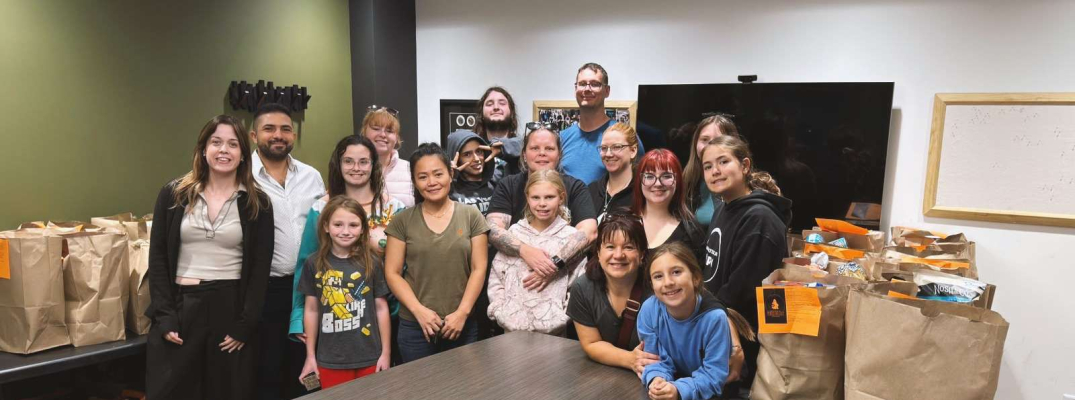 Members of TSI are joined by volunteers for the annual Trick or Eat Food Drive