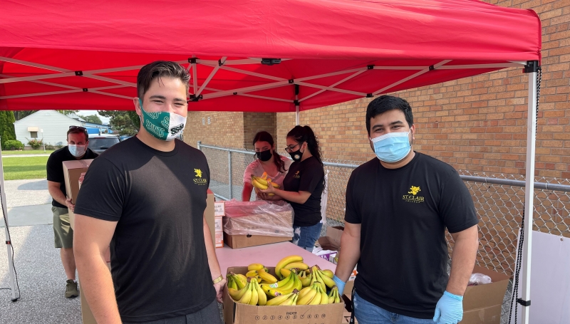 Christian Seguin, from the SSAA, and Shabham Sharma from SRC, recently volunteered with the Community Saints.