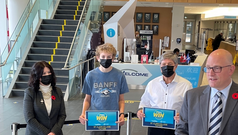 Windsor Mayor Drew Dilkens, St. Clair College President Patti France and Vice President College Communications & Community Relations John Fairley were at Windsor City Hall to greet winners of the WE Vax To Win contest.
