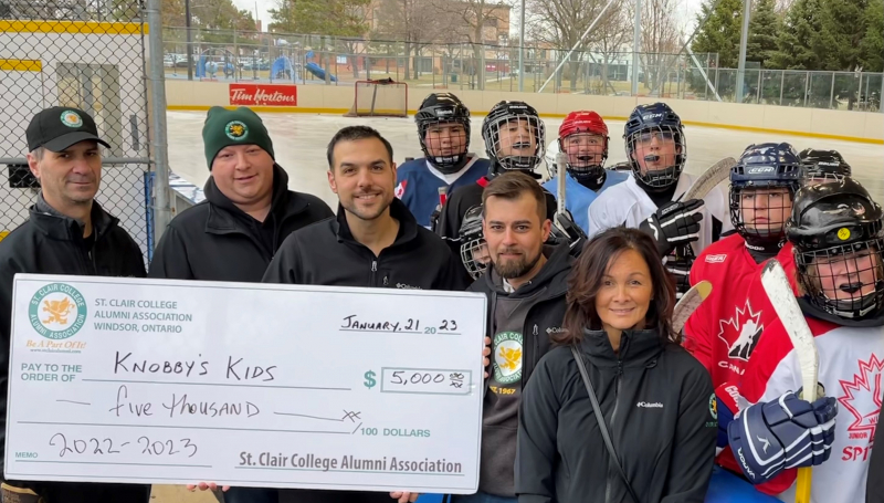 Cheque presentation at hockey rink