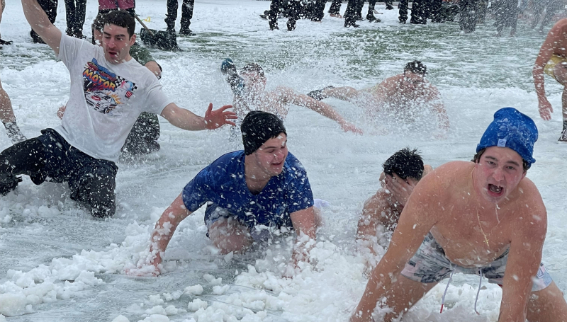 Students participating in polar slip n slide