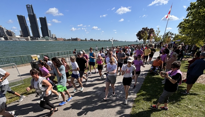 People running along river
