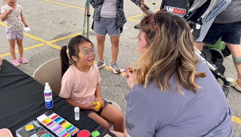 A young girl gets her face painted at the Alumni Association’s Family Fun Day at Main Windsor Campus on Sept. 13, 2025.