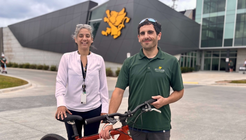 Dr. Karamjeet K. Dhillon and Kevin Roy stand out front of St. Clair College's Main Windsor Campus on Aug. 28, 2025.
