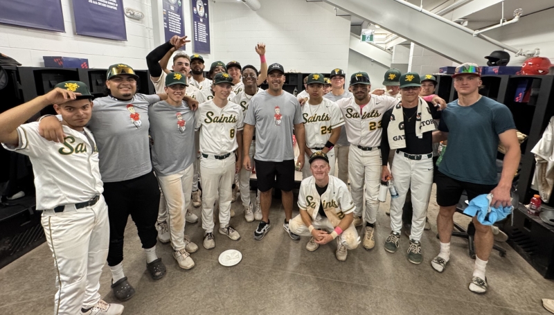 Essex-Windsor EMS Chief Justin Lammers gives the Saints Baseball a motivational message during Alumni Days at LaCasse Park on Oct. 4, 2025. 