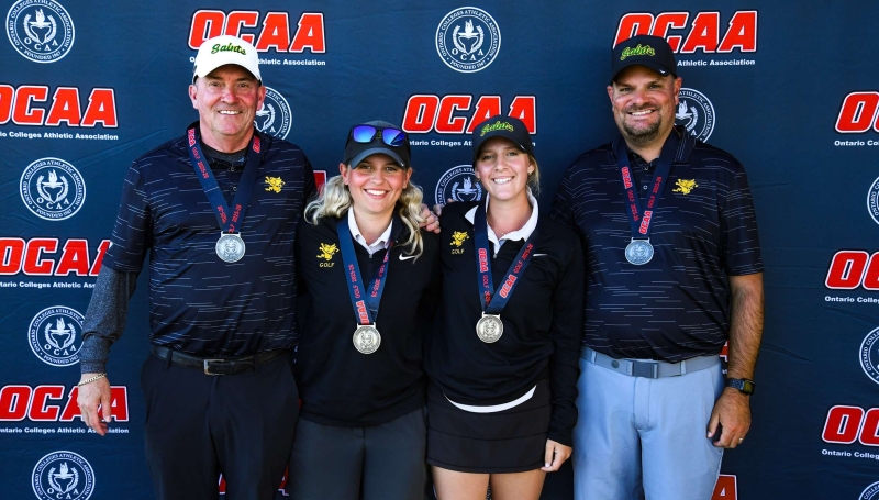 St. Clair's women's golf team, featuring head coach Kevin Corriveau, Justine Gorham, Alyssa Cowling and Assistant Coach Chris Meloche at the OCAA Championship on Oct. 1, 2025. 
