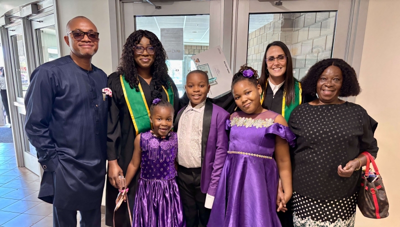 Ibiso Briggs (second from left) stands with her family and Prof. Marnie Edghill (second from right) at the 2025 Fall Convocation ceremony in Windsor at the WFCU Centre on Sept. 30, 2025. 