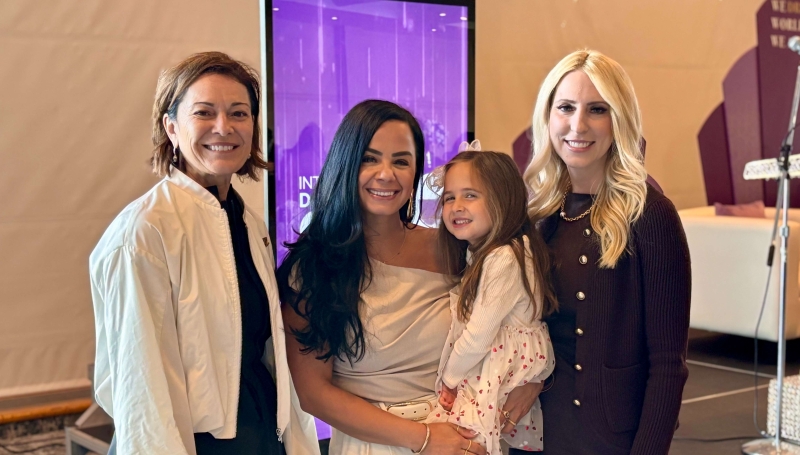 Monica Staley Liang, Nour Hachem (with her daughter) and Yvonne Pilon pose for a picture at the International Day of the Girl at the St. Clair College Centre for the Arts on Oct. 9, 2025.