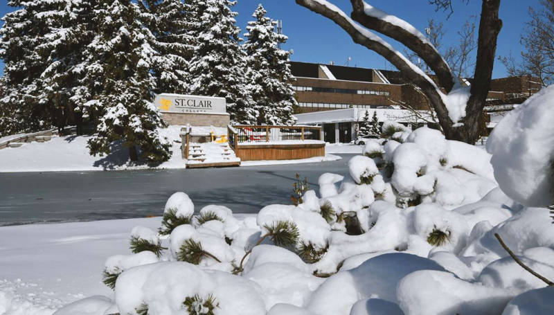 College pond and area covered in ice and snow