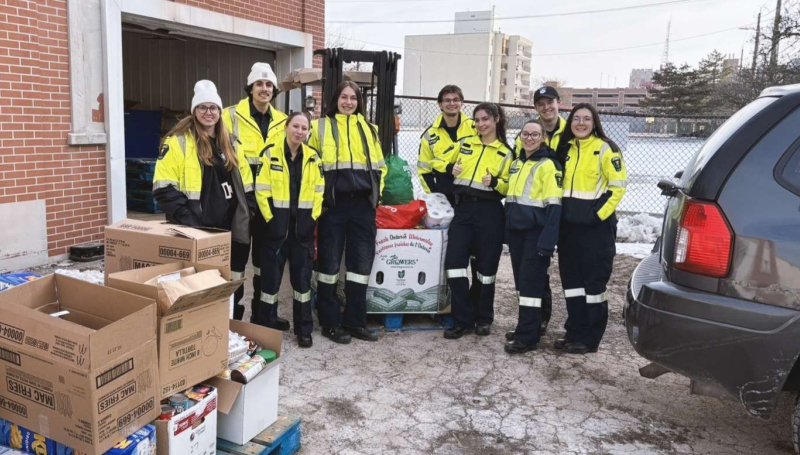 Students in St. Clair College's Paramedic program collect non-perishable goods and deliver them to Windsor's Downtown Mission