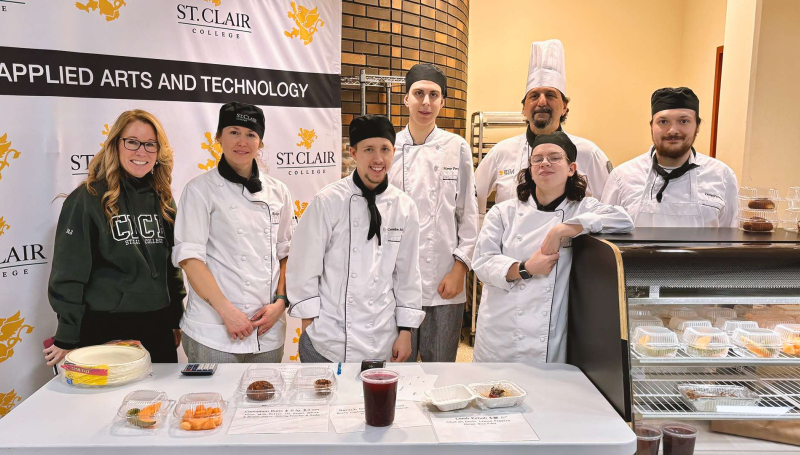 Students and faculty in the Community Integration through Cooperative Education program dish out food at The Wedge