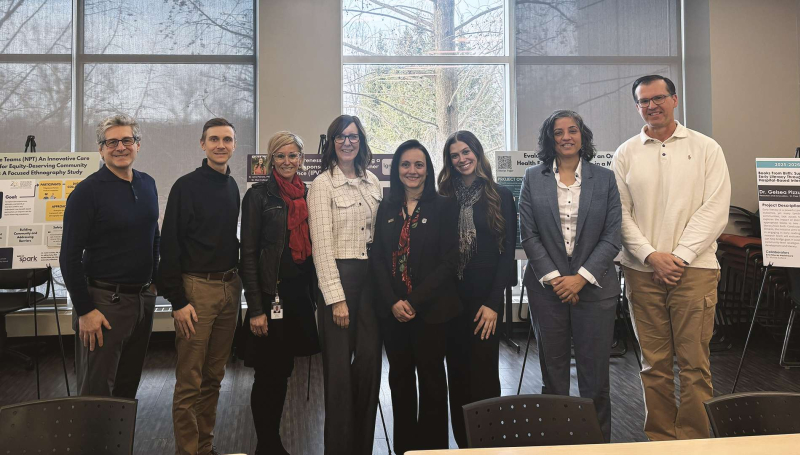 St. Clair College and WE-SPARK Health Institute representatives gather for a photo, capturing the shared commitment to advancing community health through partnership, education, and action.