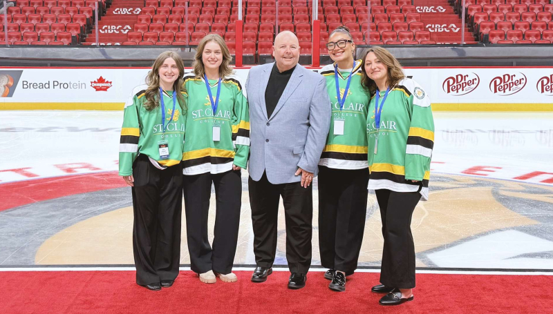 Elle Hebert, Airika Natyshak, Aryanna Pierson, Sausha Goodhand and Prof. Dwayne St. John at the Canadian Tire Centre in Ottawa, Ont. for the NHL Hockey Innovation Competition