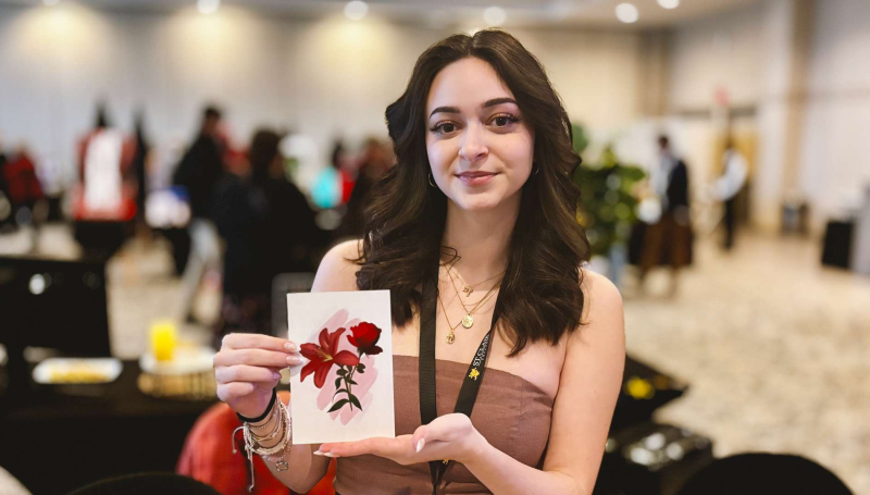 SamiaRose Ferrarelli, a third-year Graphic Design student at St. Clair College showcases her mural work during the annual Grad Show